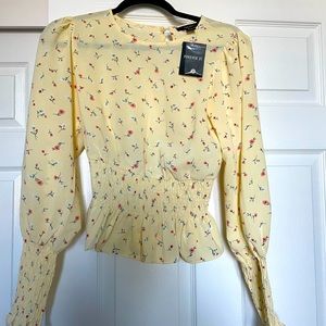 Yellow floral peplum blouse